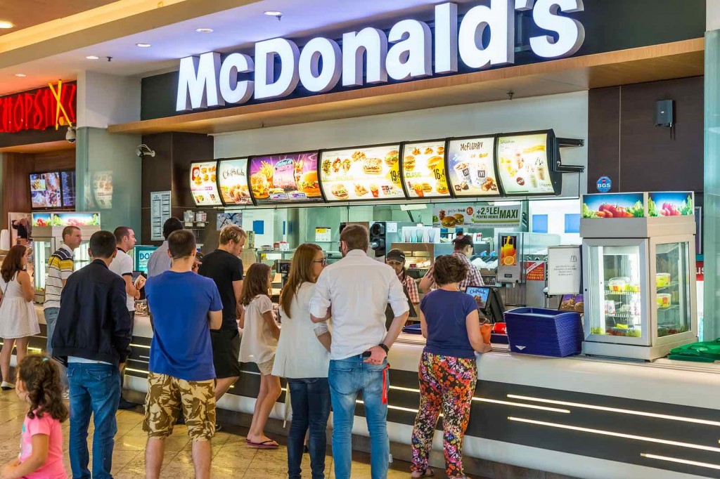 People buying fast-food from McDonald's Restaurant